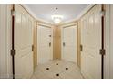 Well-lit hallway with neutral-colored walls and doors at 125 E Harmon Ave # 1620, Las Vegas, NV 89109