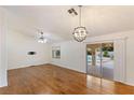 Bright dining room with hardwood floors and view of pool at 1420 Ellen Tracy Way, Henderson, NV 89014