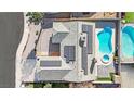 House with solar panels, pool, and spa seen from above at 1627 Candice St, Las Vegas, NV 89156