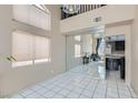 Open dining area with mirrored wall and access to kitchen at 2108 Royal Antilles Ct, North Las Vegas, NV 89031