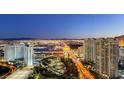 Aerial view of Las Vegas skyline at dusk, featuring city lights and high-rise buildings at 222 Karen Ave # 3601, Las Vegas, NV 89109