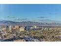 Daytime aerial view showcasing Las Vegas's expansive cityscape, mountains, and residential areas at 222 Karen Ave # 3601, Las Vegas, NV 89109