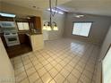 Open dining area with kitchen and living room views at 2235 High Dunes Ln, Laughlin, NV 89029