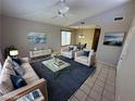 Living room with staged furniture and view of dining area at 2235 High Dunes Ln, Laughlin, NV 89029