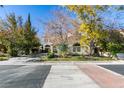 Two-story house with landscaped yard and driveway at 2469 Sun Reef Rd, Las Vegas, NV 89128