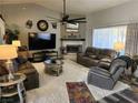 Spacious living room with fireplace, large TV, and comfy seating at 2651 Homestead Rd, Pahrump, NV 89048