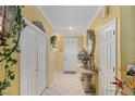 Bright entryway with tiled floors and decorative console table at 2707 White Sage Dr, Henderson, NV 89052