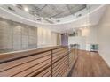 Modern interior with hardwood floors and a lofted area at 353 E Bonneville Ave # 103, Las Vegas, NV 89101