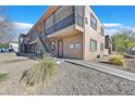 Building exterior showcasing a stairway and well-maintained landscaping at 4186 Silver Dollar Ave # 8, Las Vegas, NV 89102