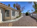 Side view of house with walkway and gravel landscaping at 5954 Wabusca Way, Las Vegas, NV 89142