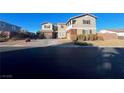 Two-story house with brick and siding, two-car garage, and landscaped yard at 7458 Mezzanine View Ave, Las Vegas, NV 89178