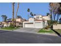 Two-story home with a two-car garage and nicely landscaped front yard at 7500 Orange Haze Way, Las Vegas, NV 89149