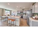 Modern kitchen with island and stainless steel appliances at 7526 Bosco Brook Dr # 41, North Las Vegas, NV 89084