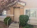 Townhouse entrance with stairs and landscaping at 1142 Grass Pond Pl # 3, Henderson, NV 89002