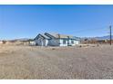 Ranch-style home with fenced yard and gravel area at 1510 Princeton Cir, Pahrump, NV 89060