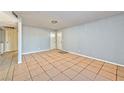 Living room with tile floors and access to the kitchen and hallway at 2708 Bello Dr, North Las Vegas, NV 89030