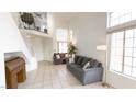 Spacious living room with two sofas and large windows at 3425 Trilogy Dr, Las Vegas, NV 89108