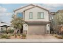 Charming two-story home featuring a well-manicured lawn and a two-car garage at 4372 Panoramic View Ave, North Las Vegas, NV 89084