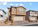 Tan two-story house with neutral garage door and nicely landscaped yard at 6986 Bard Ave, Las Vegas, NV 89113