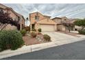 Two-story house with attached garage and landscaping at 7632 Highland Pony St, Las Vegas, NV 89149