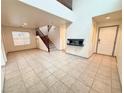 Living room with tile floors and a fireplace at 7632 Highland Pony St, Las Vegas, NV 89149