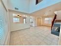 Spacious living room with high ceilings and tile floors at 7632 Highland Pony St, Las Vegas, NV 89149