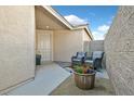 Cozy front patio with seating area and potted plants at 988 Buffalo River Ave, Henderson, NV 89002