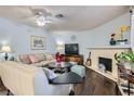 Living room features a fireplace, comfy seating, and hardwood floors at 1301 Pinto Rock Dr # 201, Las Vegas, NV 89128