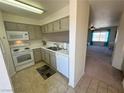 Bright kitchen features white appliances and ample cabinet space at 2036 Mesquite Ln # 303, Laughlin, NV 89029