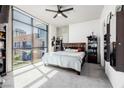 Bedroom with city views and ceiling fan at 353 E Bonneville Ave # 632, Las Vegas, NV 89101