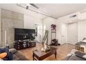 Spacious living room with hardwood floors, neutral paint, and a ceiling fan at 353 E Bonneville Ave # 632, Las Vegas, NV 89101