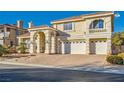 Two-story house with a brick driveway and a three-car garage at 6250 Pale Pavilion Ave, Las Vegas, NV 89139