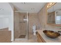 Bathroom with walk-in shower, toilet, and modern vanity at 7220 Stormson Dr, Las Vegas, NV 89145
