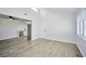 Open living room and kitchen with wood-look floors at 1701 E Katie Ave # 10, Las Vegas, NV 89119