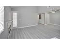 Open living area featuring a fireplace and laminate floors at 1701 E Katie Ave # 32, Las Vegas, NV 89119