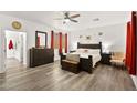 Large main bedroom with king-size bed, dresser, and ensuite bathroom access at 2134 Dillons Cove Dr, Laughlin, NV 89029