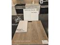Bathroom design samples with upgraded cabinets, quartz countertops, and vinyl plank flooring at 6905 Cottage Vista Ave, Las Vegas, NV 89113
