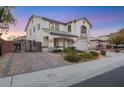 Two-story house with landscaped yard, walkway, and attached garage at 781 Wigan Pier Dr, Henderson, NV 89002