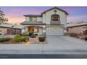Two-story house with landscaped yard, walkway, and attached garage at 781 Wigan Pier Dr, Henderson, NV 89002