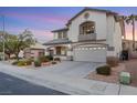 Two-story house with landscaped yard, walkway, and attached garage at 781 Wigan Pier Dr, Henderson, NV 89002