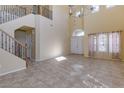 Spacious living room with high ceilings and tile floors at 9893 Cove Haven Ct, Las Vegas, NV 89178