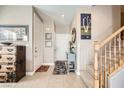 Bright entryway with stairs, tile floors, and a console table at 1336 Allegheny Moon Ter # 3, Henderson, NV 89002