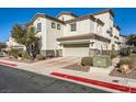 Two-story house with attached garage, landscaping, and a driveway at 1336 Allegheny Moon Ter # 103, Henderson, NV 89002