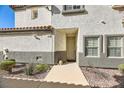 Front entrance of the house with walkway and landscaping at 1336 Allegheny Moon Ter # 103, Henderson, NV 89002