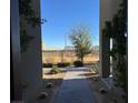 Brick walkway leads to the entrance of the home with desert landscaping at 1536 Unison Way # 102, Las Vegas, NV 89135