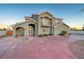 Two-story house with a large driveway and front entrance at 1964 Westwind Rd, Las Vegas, NV 89146