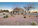 House exterior with a spacious yard and mature trees at 1964 Westwind Rd, Las Vegas, NV 89146