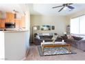 Inviting living room with a view of kitchen area and comfortable seating arrangement at 4625 Centisimo Dr # 202, North Las Vegas, NV 89084