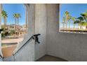 View from a stairwell showing palm trees and a community view at 50 Aura De Blanco St # 17204, Henderson, NV 89074