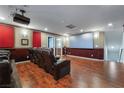 Home theater with leather seating and large projection screen at 5956 Lambert Bridge Ave, Las Vegas, NV 89139